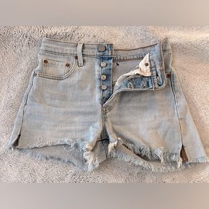 Light wash vintage Levi cutoffs.